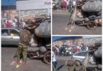 Young man in NYSC uniform spotted pushing heavily loaded truck in Port Harcourt