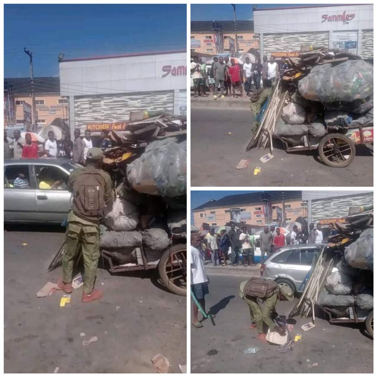 Young man in NYSC uniform spotted pushing heavily loaded truck in Port Harcourt 