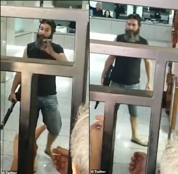 Man armed with a shotgun holds bank staff hostage and threatens to set himself on fire unless they hand over 0,000 locked in his account (videos)